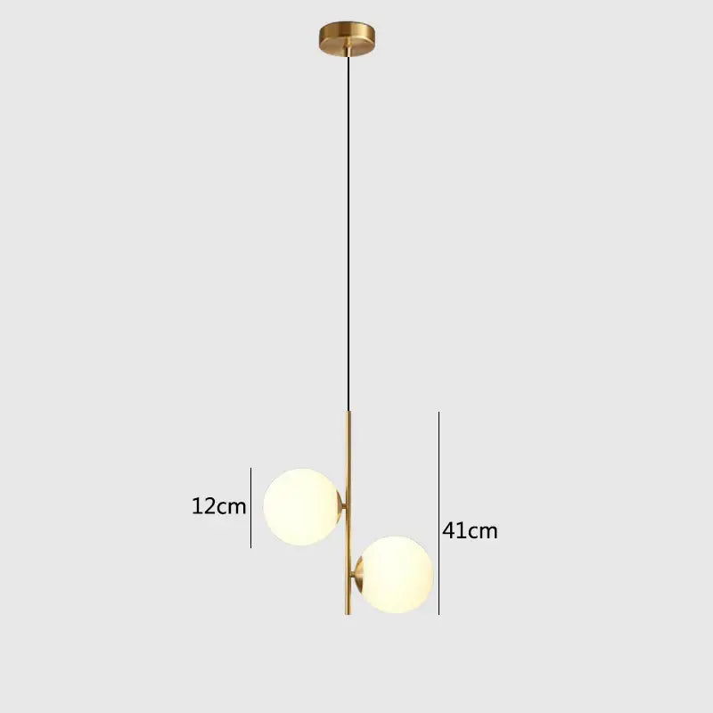 Modern brass and black glass ball pendant light with frosted glass spheres suspended by black cord for dining room decorbites glass ball