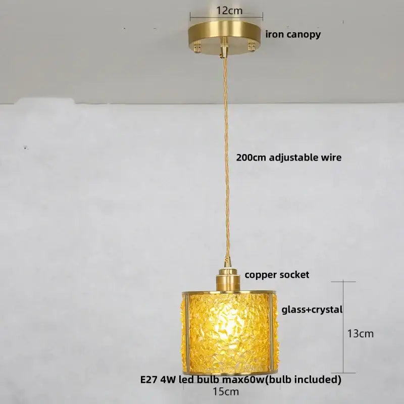 Modern brass and blue crystal glass pendant light fixture with golden glass, brass canopy, and adjustable wire
