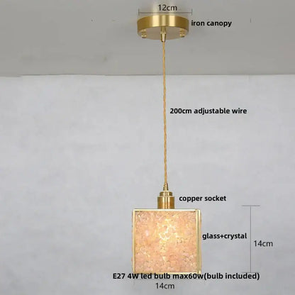 Modern brass and blue crystal glass pendant light fixture with gold-toned frame and textured shade for kitchen use