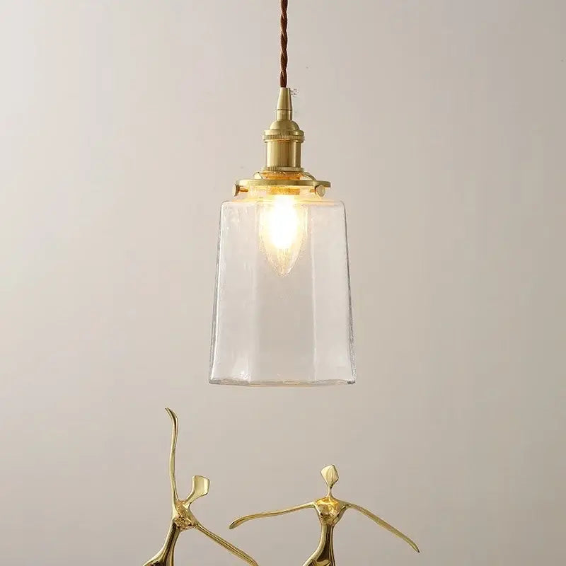 Modern brass and clear glass led pendant lamp with a braided cord ideal for dining room decorbites clear glass design