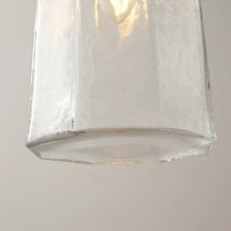 Modern brass and clear glass led pendant lamp with hexagonal textured glass and amber glow for dining room decorbites clear glass