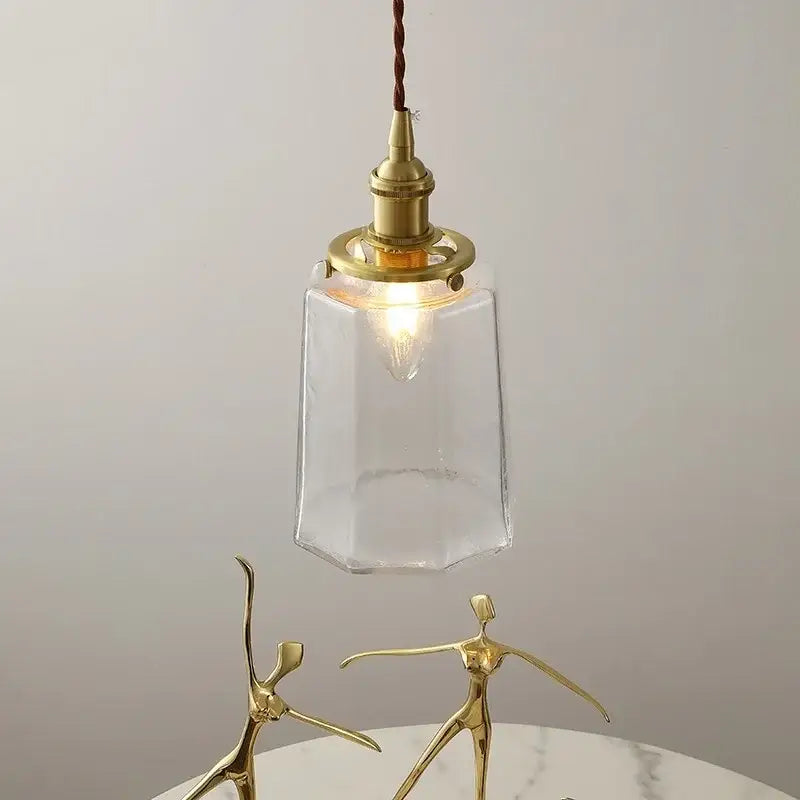 Modern brass and clear glass led pendant lamp with a brass fixture and twisted cord for dining room decorbites clear glass
