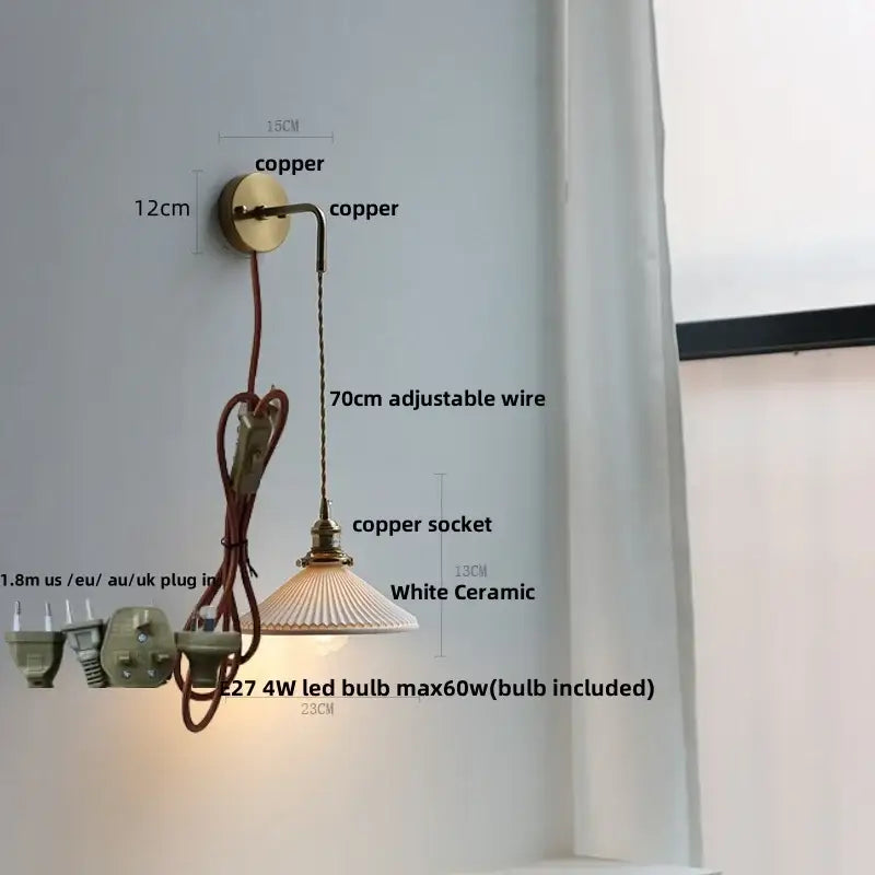 Modern brass wall lamp with clear glass and copper sconce featuring white ceramic shade and adjustable wire decorbites clear glass