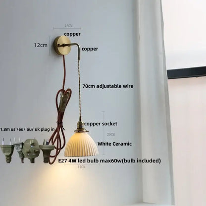 Modern copper wall lamp with white ceramic fluted shade and adjustable wire featured in decorbites clear glass style
