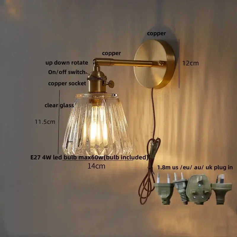 Modern brass and clear glass wall lights feature a brass-finished copper arm and decorbites clear glass shade with e27 led bulb