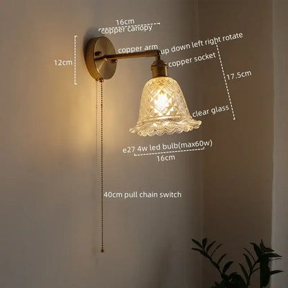 Modern brass and crystal led wall lamps featuring an antique brass finish with a clear glass shade and adjustable copper arm wall lamps
