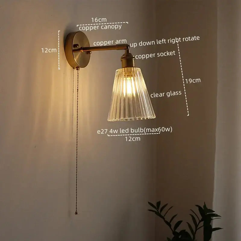Antique brass-finished copper led wall lamps with clear fluted glass shade and adjustable arm for bedroom sconce lighting