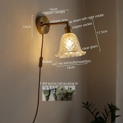 Modern brass and crystal led wall lamp with copper finish and clear etched glass shade for bedroom use