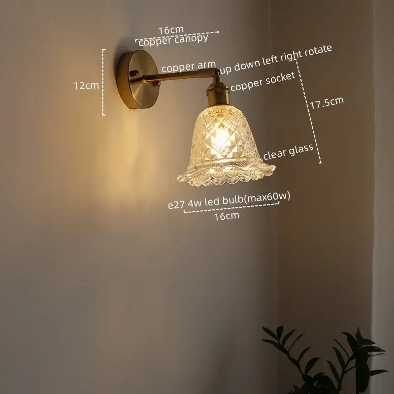 Modern brass and crystal led wall lamps featuring a vintage-style copper wall sconce with a clear cut glass shade
