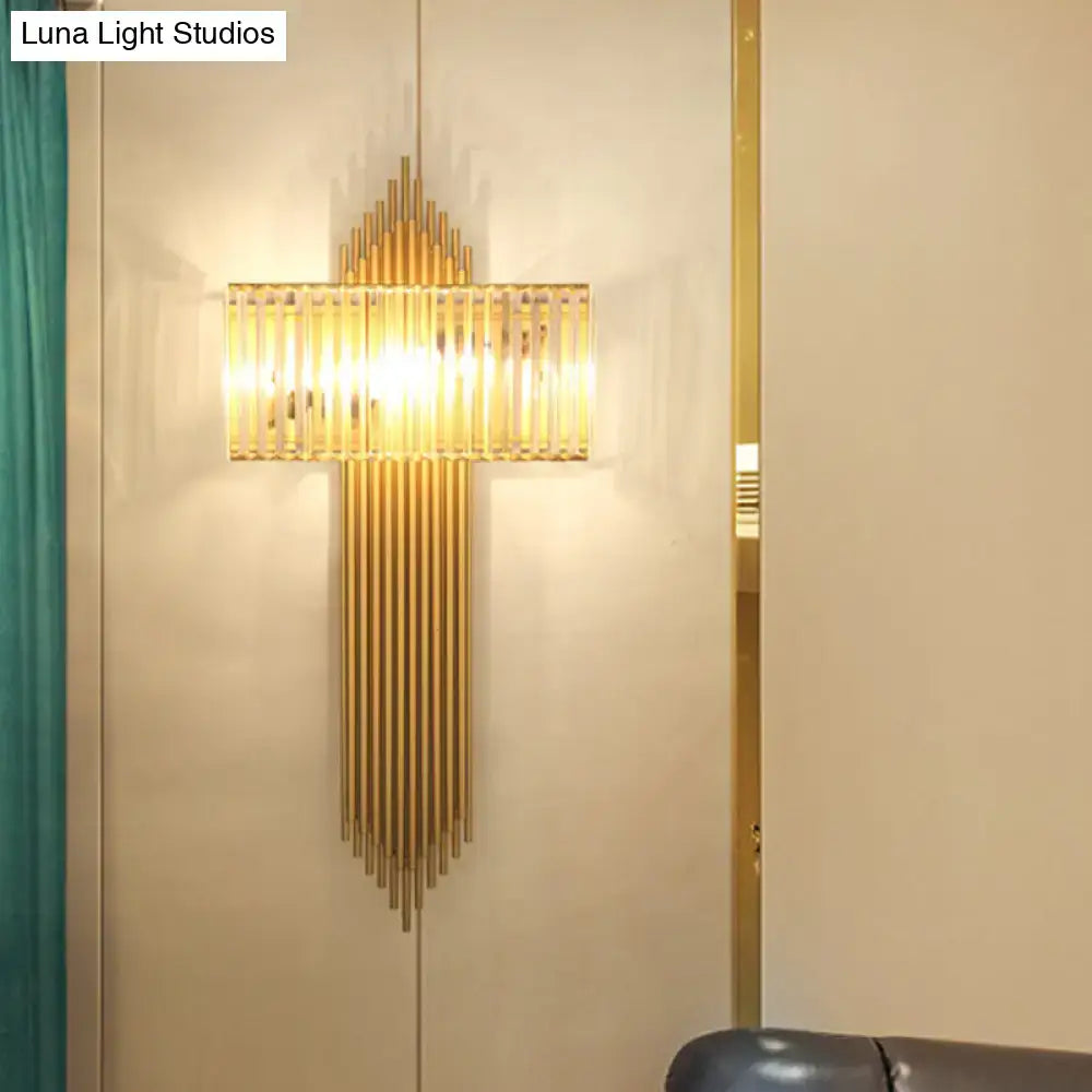 Modern brass and crystal rectangular wall lighting with gold-toned vertical rods and a glass panel emitting warm light