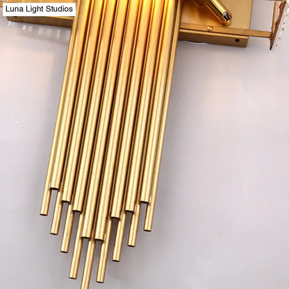 Modern brass and crystal rectangular wall lighting featuring golden brass rods in a cascading fan-like pattern