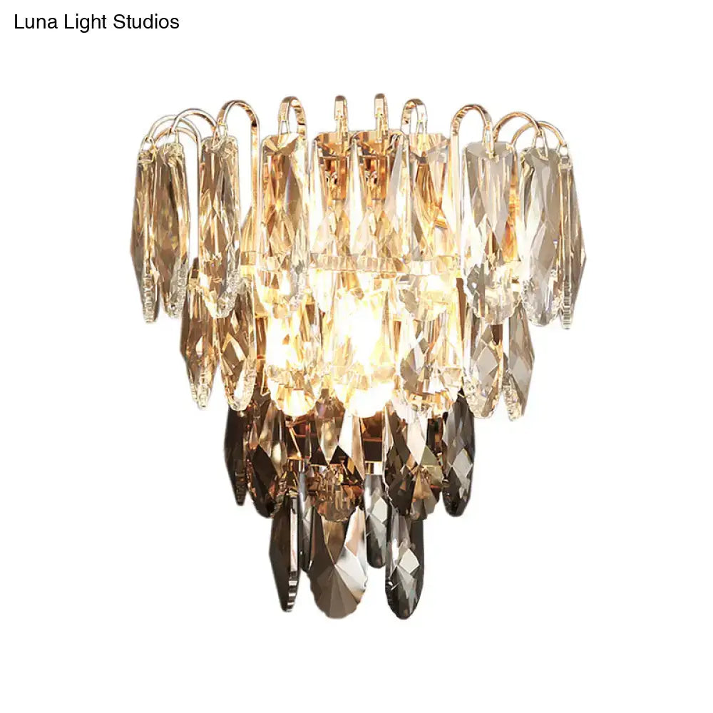 Modern brass and crystal tiered wall sconce bedroom chandelier with gold-toned metal and cascading clear smoky amber crystals