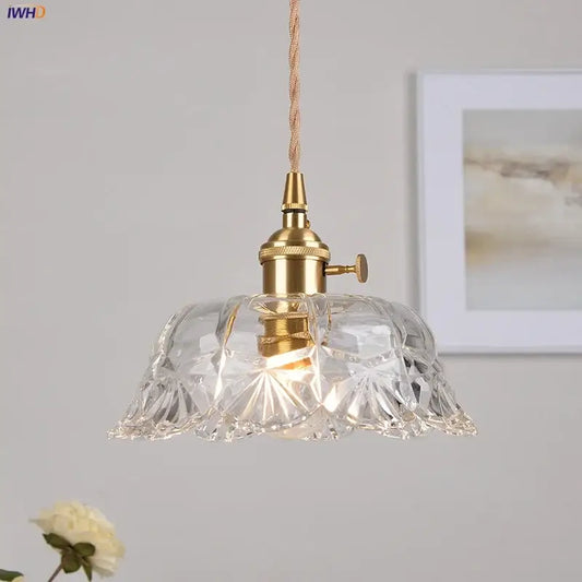 Modern brass and cut glass led pendant light with clear intricately cut glass and edison-style bulb for dining room
