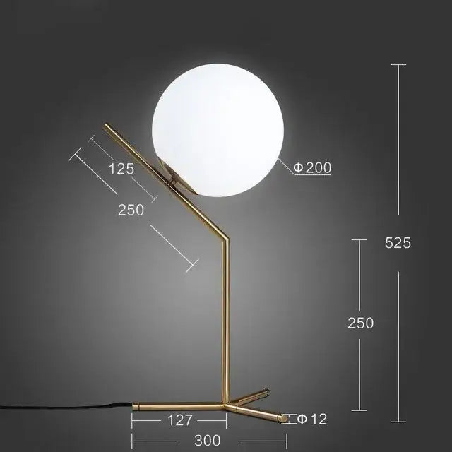Modern brass pendant light with a gold-toned metal base and frosted glass ball shade by decorbites light fixture