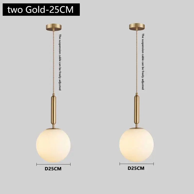 Modern brass and frosted glass pendant light with spherical globes and adjustable suspension cables for dining room chandelier pendant light