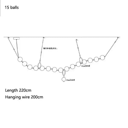 A diagram of a modern brass and glass ball pendant light fishing rig with 15 spherical floats and labeled components