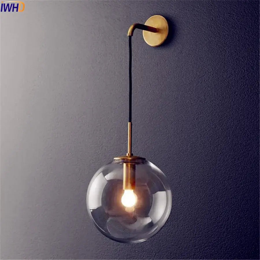 Modern brass and glass ball wall lamp bathroom sconce with brass finish clear glass ball and black cord decorbites glass ball