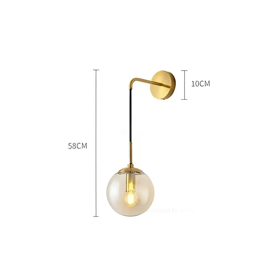 Modern brass and glass ball wall lamp with gold-toned spherical frosted glass ball and exposed filament bulb for bedroom decorbites decor