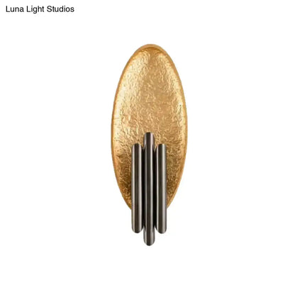 Modern brass and glass wall light with gold-toned oval sconce and four vertical matte black rods with e12 e14 base