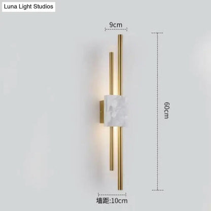 Modern brass and green marble led wall lamp with gold-toned rods and white marble accent for living room lighting