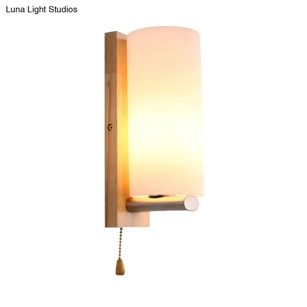 Modern brass and opal glass wall lamp with warm-toned frosted shade and wooden backplate for 220v-240v use