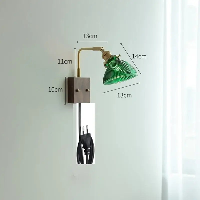 Modern brass wall lights featuring a green ribbed clear glass lampshade on a dark bronze square wall plate by decorbites clear glass