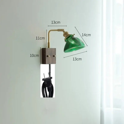 Modern brass wall lights featuring a green ribbed clear glass lampshade mounted on a brass arm and dark metal base decorbites clear glass
