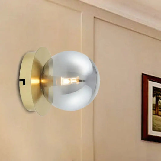 Modern brass and smoky glass shade wall lamp with brushed brass base and chrome sphere light fixture for bedroom