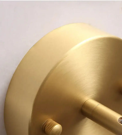 Modern brass and walnut led wall sconce with brass finish and adjustable arm for bedroom spotlight lighting