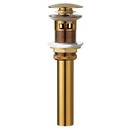 Modern brass and white ceramic basin waste drain with gold-toned metal cylindrical body and fluted top cap for bathroom sink