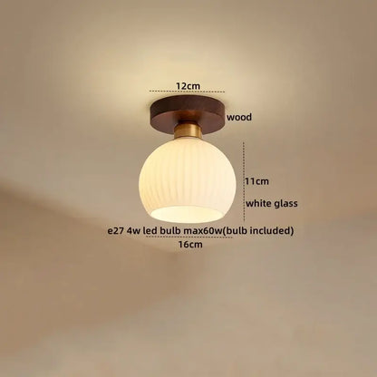 Modern brass and wood led ceiling light featuring a round white frosted glass pendant with brass accents for bedroom decorbites ceiling light