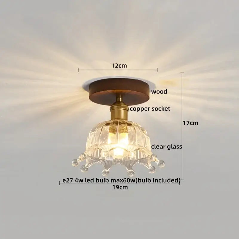 A modern brass and wood led ceiling light with frosted glass and a clear glass chandelier featuring a wooden base decorbites led ceiling