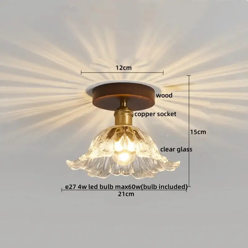 Modern brass and wood led ceiling light with a delicate clear glass chandelier and fluted petal design for decorbites led ceiling