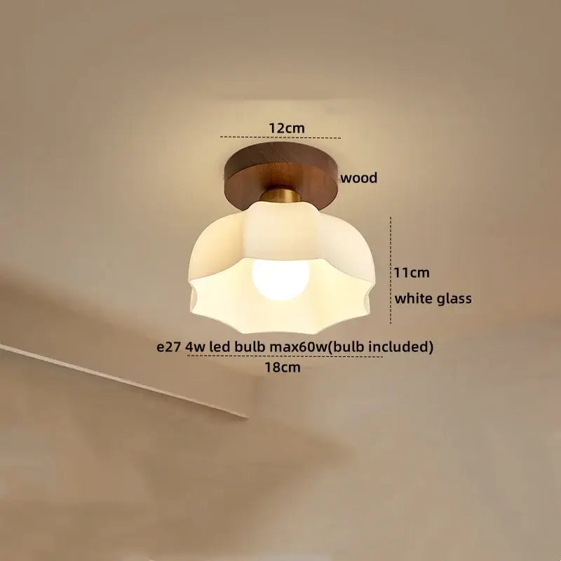 Modern brass and wood led ceiling light with warm brass base and frosted white glass shade for elegant bedroom decorbites ceiling light