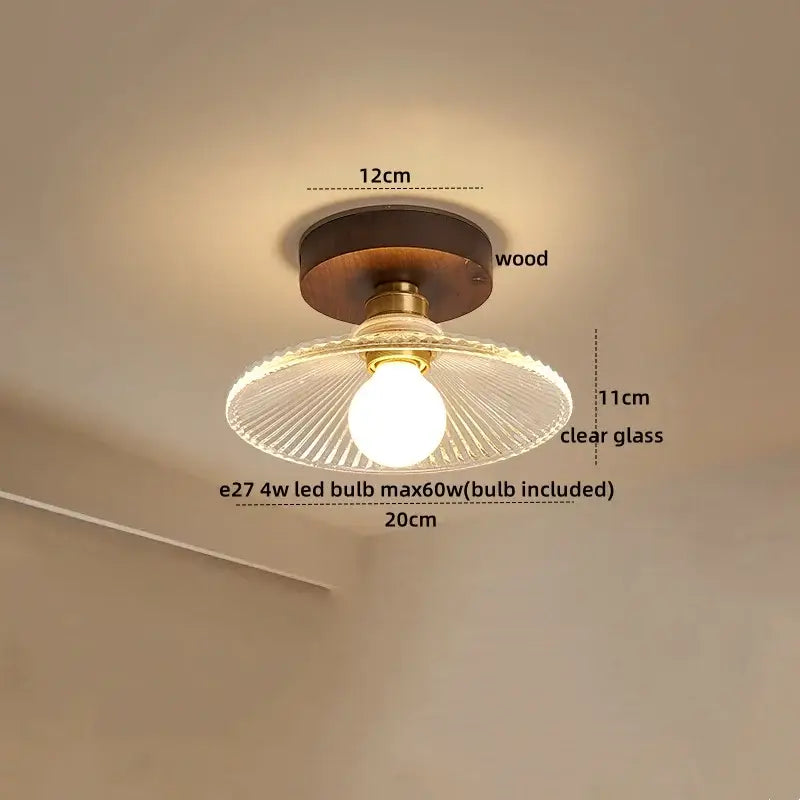 Modern brass and wood led ceiling light with dark wood base brass accents and clear radial ribbed glass shade for bedroom decorbites led ceiling