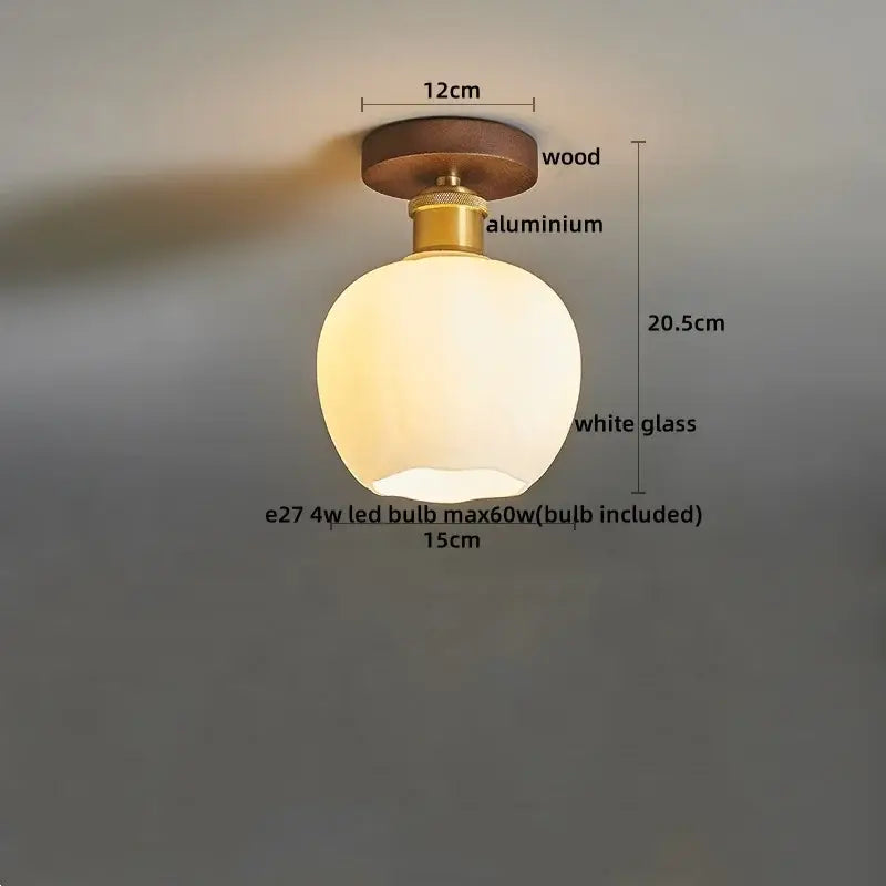 Modern brass and wood led ceiling light with frosted white glass lamp featuring wooden top and brass-colored aluminum base