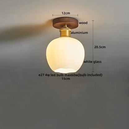 Modern brass and wood led ceiling light with frosted white glass lamp featuring wooden top and brass-colored aluminum base