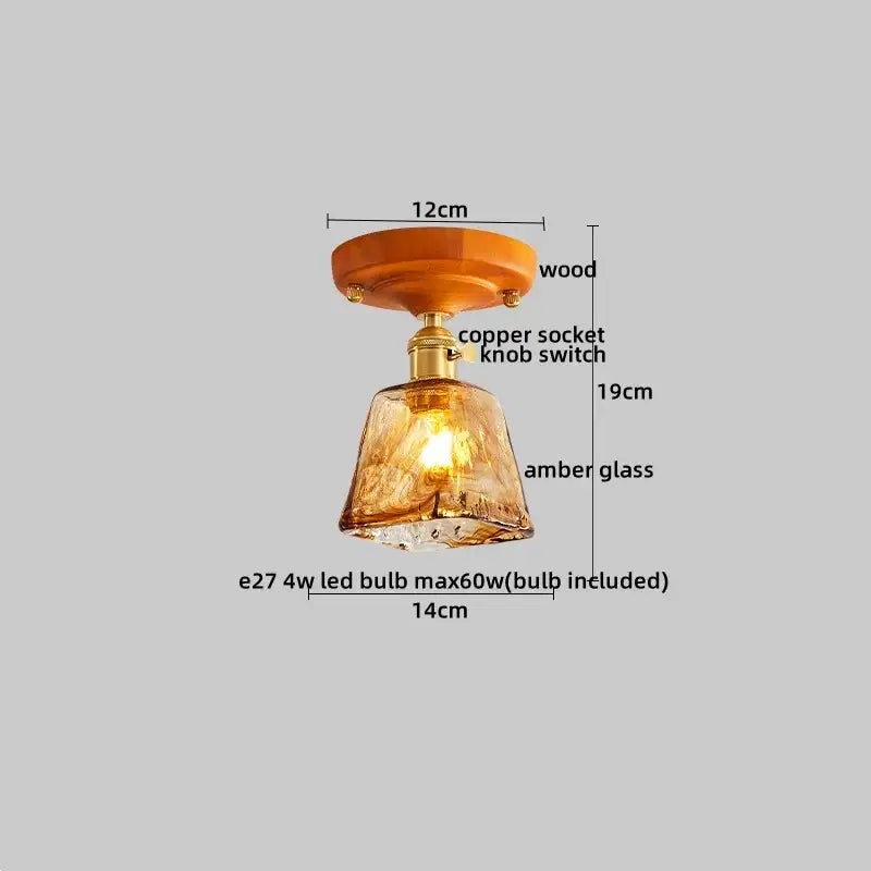 A warm amber glass modern brass and wood led ceiling light with wooden mount and copper socket for bedroom decorbites led ceiling