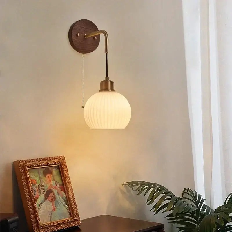 Modern brass and wood ribbed glass wall light with warm tones suitable for decorbites copper adjustable led bedroom sconce