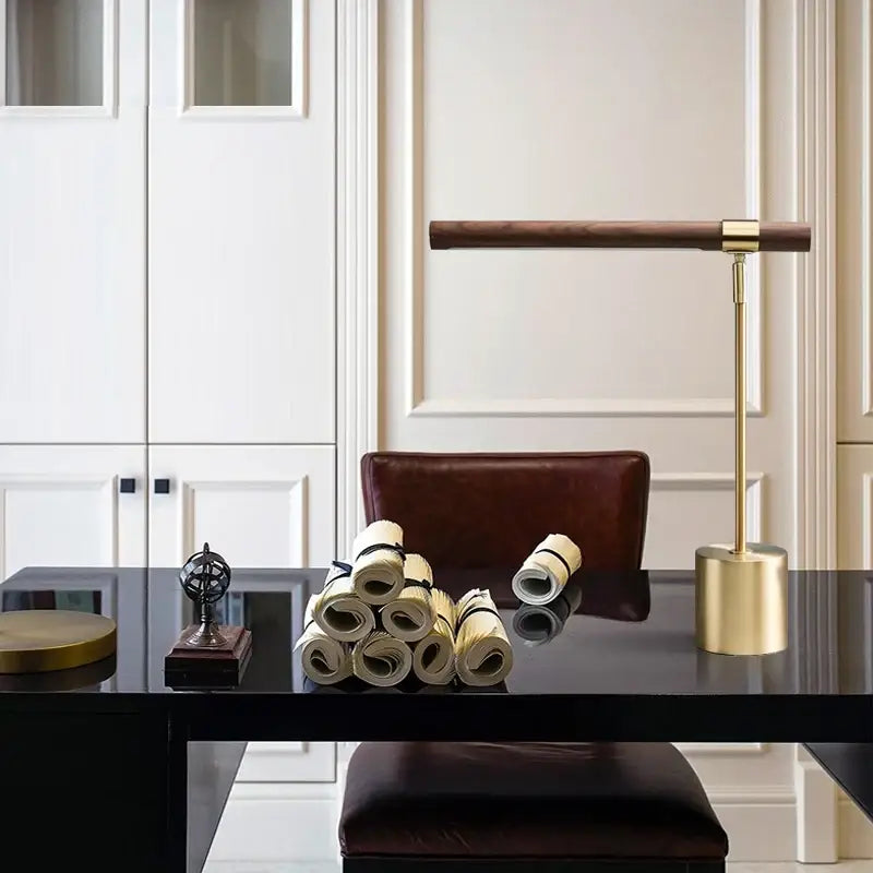 A modern brass and wood table lamp with a sleek brass finish and dark wood base for bedroom decorbites led wood