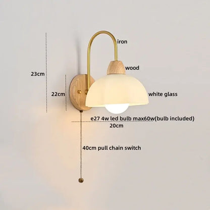 A warm brass iron wall lamp with natural wood backplate and white glass dome for modern led wall lamps decorbites