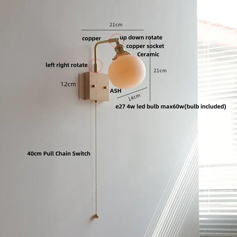 Modern copper-finished wall light fixture with ceramic globe shade and adjustable pull chain for bedroom use