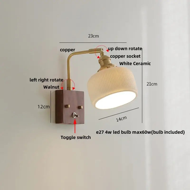 Modern brass and wood wall light fixture with copper finish, white ceramic shade, and walnut wood base for bedroom use