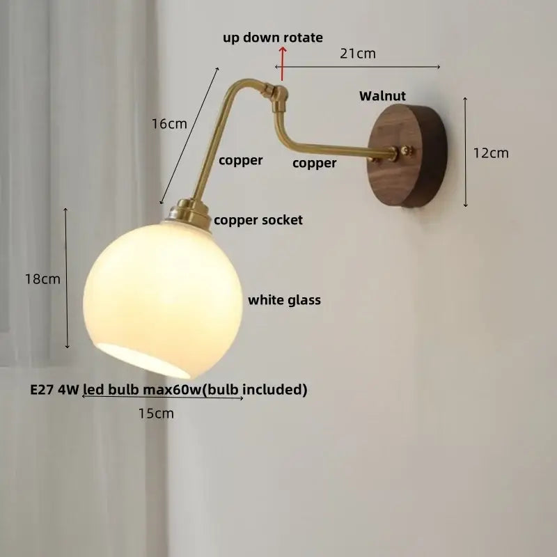 Modern brass and wood wall sconce with copper finish, white glass globe, walnut mount, amber led decorbites copper glass