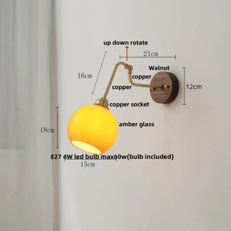 Modern brass and wood wall sconce with copper amber led glass globe and walnut-finished mounting plate decorbites copper glass