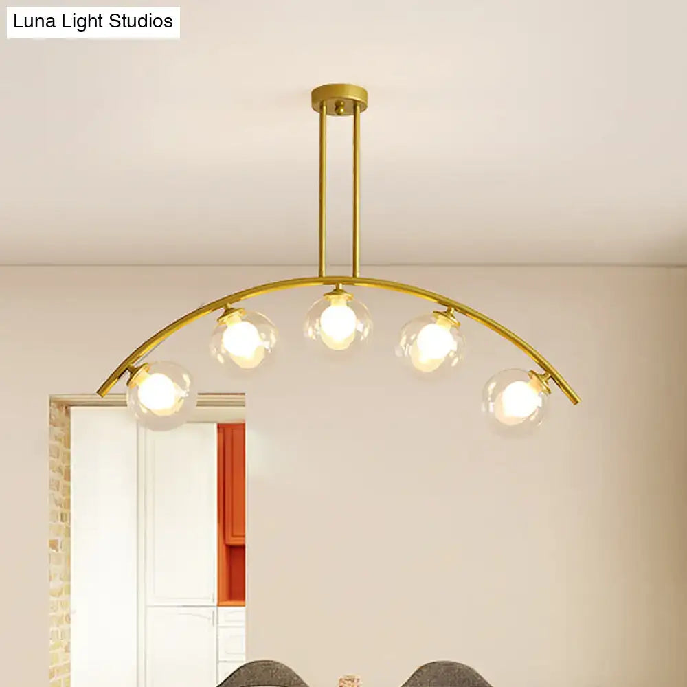Decorbites modern glass orb island pendant light with five clear bulbs and brass arch arm in white and gold tone