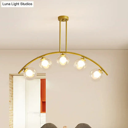 Decorbites modern glass orb island pendant light with five clear bulbs and brass arch arm in white and gold tone