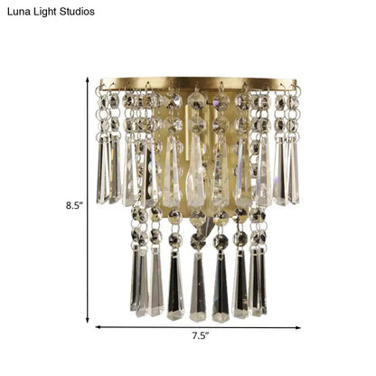 Modern brass wall sconce with gold finish and cascading clear beveled glass crystal beads for corridor lighting