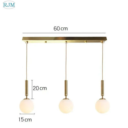 Modern brass pendant light with three gold-toned decorbites glass ball led frosted shades for dining room decor
