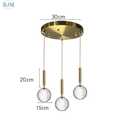 Modern brass and black glass ball led pendant light featuring gold-toned ceiling fixture with three textured glass globes